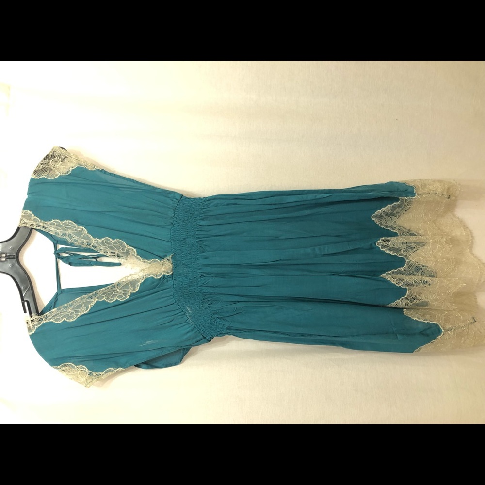 Turquoise swim cover with cream lace trim